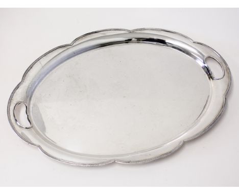 An oval silver tray. Harrison Bothers and Howson. Sheffield 1931. Wt. 50oz. L51.5cm