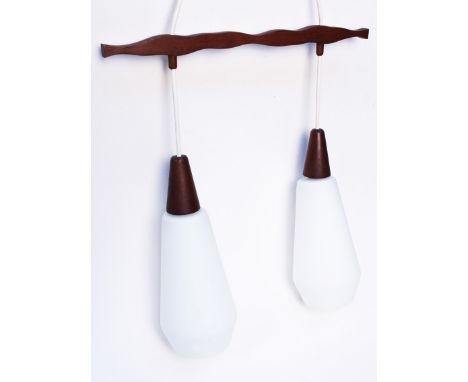 A retro frosted glass and teak drop down light fitting. Circa 1960