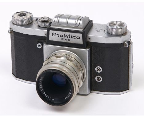 A Praktica FX SLR 35mm camera, with Carl Zeiss Jena Tessar 50mm F2.8 lens, with original case  In apparently working order, w