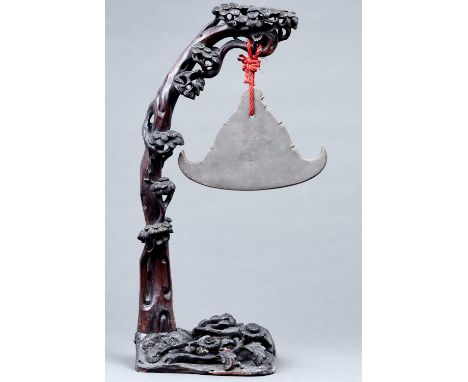 A Chinese prunus carved wood gong with paktong chime, c1900,&nbsp;60cm h  Shrinkage cracks in trunk