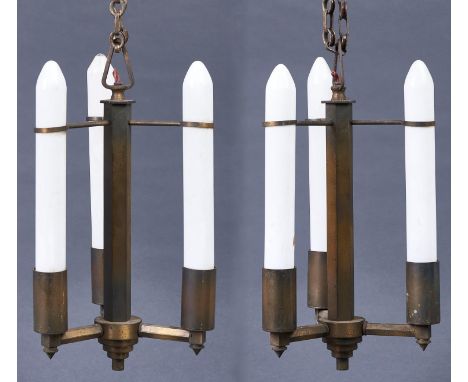 A pair of Art Deco brass hanging lights, c1950, retaining the original opal candle form light bulbs, 42cm h  In entirely orig