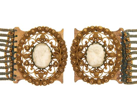 A pair of Victorian cameo, pinchbeck and knitted light blue wool bracelets, c1850, each slide set with a glass paste cameo of