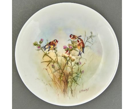 An outside decorated plate, probably Royal Worcester, c1919-39, painted by G Moseley, signed, with goldfinches on thistles, 2