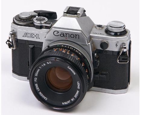 A Canon AE-1 SLR 35mm camera, with Canon FD 50mm F1.8 S.C. Breech Lock lens  In apparently working order, wear consistent wit