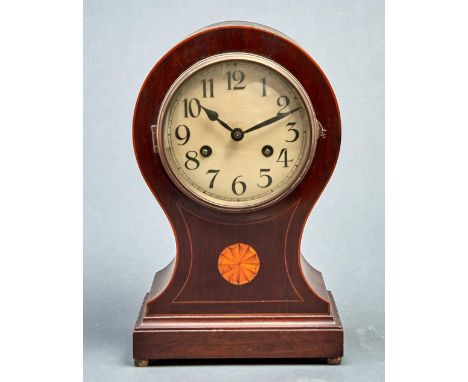 An Edwardian inlaid mahogany balloon shaped mantel clock,&nbsp;the cream enamel dial with Arabic numerals, twin winding holes