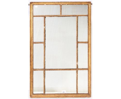 A George III giltwood and composition mirror, the beaded rectangular frame with larger central rectangular plate in a surroun