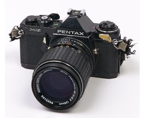 A Pentax ME SLR 35mm camera, with SMC Pentax-M 135mm F2.8 lens  In apparently working order, good condition, lens dusty; coul