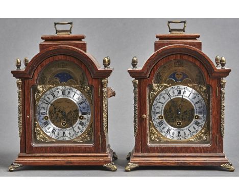 A pair of reproduction giltmetal mounted oak arch top bracket clocks, the silvered and brass dial with lunar work inscribed C