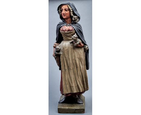 An unusual Northern European cold painted terracotta figure of a woman, probably British, possibly intended as a display for 