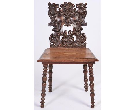 A Victorian carved walnut hall chair, with boarded seat on bobbin turned legs, seat height 43cm  Movement to legs, boarded se