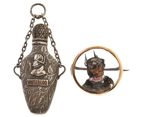 A reverse pained painted intaglio brooch, late 19th c, with the head of a dog, in gold, 31mm and a plated brass scent flask, 