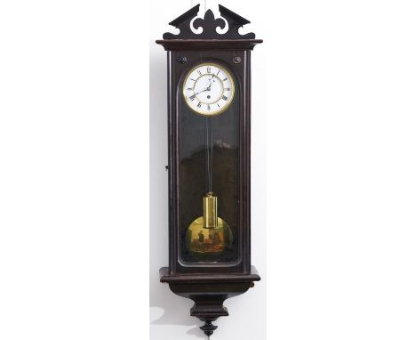 A Continental mahogany-stained beech wall clock, the broken architectural pediment centred of a fleur de lis, arched glazed c