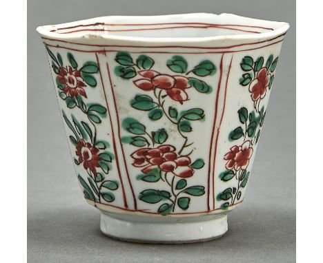 A Chinese famille verte hexagonal cup, Qing dynasty, Kangxi period, of flared hexagonal shape, painted to each side with flow