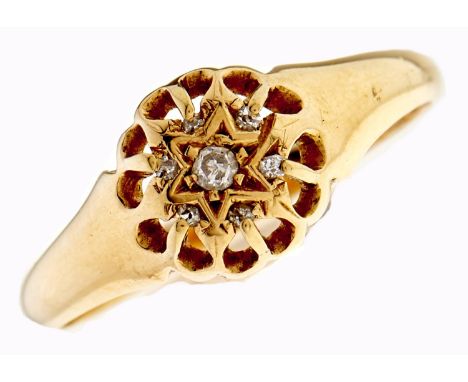 A star centred diamond cluster ring, in 18ct gold, Birmingham 1919, 2.6g, size O  Light wear only