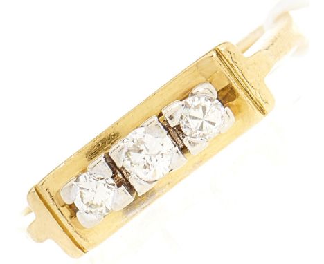 An 18ct gold three stone diamond ring, 4.1g, size M½  