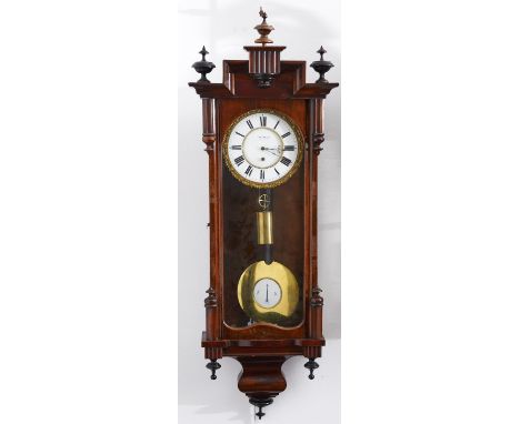 A Viennese mahogany-stained beech cased wall clock, late 19th c, the stepped pediment centred on a fluted tablet above an arc