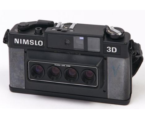 A Nimslo stereo 35mm camera, with Quadra 30mm lens, with original box  Sold 'as seen', intended as spares / repairs