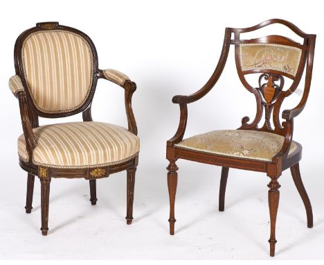 An Edwardian inlaid mahogany salon chair, c1905, the concave shield shaped back with pierced serpentine shaped top rail above