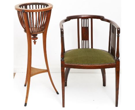 An Edwardian inlaid mahogany tub chair, with lozenge inlaid vertical railed splats, upholstered seat with close studded borde