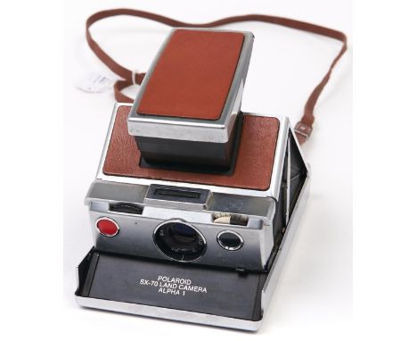 A Polaroid SX-70&nbsp;Alpha 1 camera, silver and tan model, with styrofoam box  Untested, sold as seen