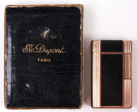 A gold plated and black lacquer cigarette lighter,&nbsp;by S T Dupont, Paris, original box  Good condition