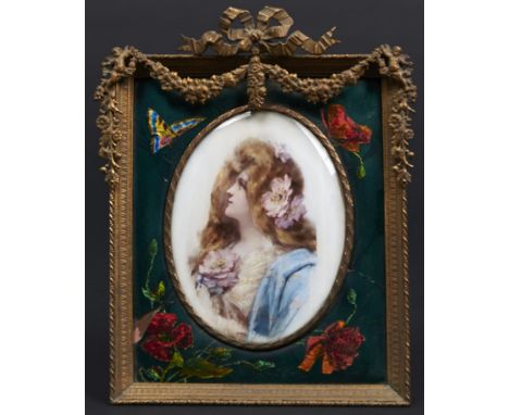 A Continental porcelain plaque, early 20th c, painted with a raven haired beauty and flowers, in contemporary giltmetal and L