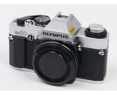 An Olympus OM20 SLR 35mm camera body, with body cap, instructions and original box  In apparently working order, good conditi
