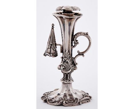 A Victorian silver taperstick, of flared shape with double scroll handle, conical extinguisher and floriform nozzle, crested,