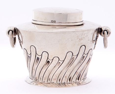 An Edwardian two handled oval silver tea caddy and cover, wrythen fluted, 7.5cm h, by W Hutton &amp; Sons Ltd, Birmingham 190