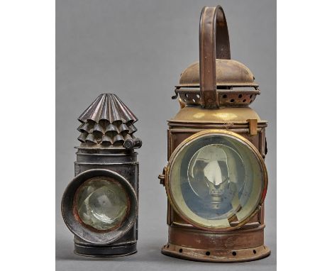 A Hiatt &amp; Co black lacquered police bull's eye lantern, with three stack chimney, bearing maker's plaque, 20cm h; a brass