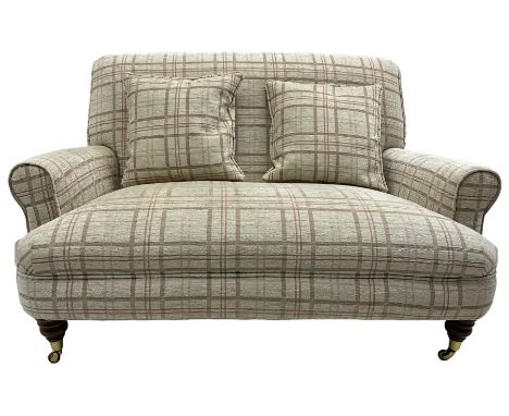 Traditionally shaped two-seat sofa, rolled back and arms, upholstered in checkered fabric, on turned front supports with bras