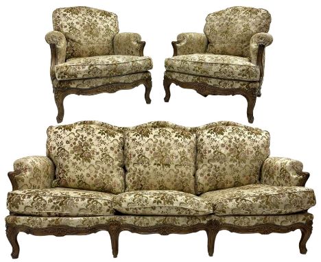 Early 20th century French carved stained beech framed three piece suite, comprising two deep seated armchairs (W76cm D93cm H8