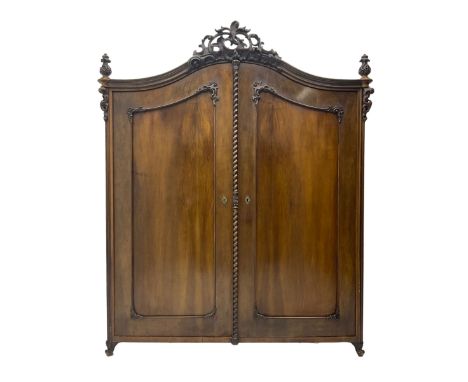 Early 20th century Italian walnut armoire wardrobe, the pierced and scrolling pediment carved with acanthus leaf detail, flan