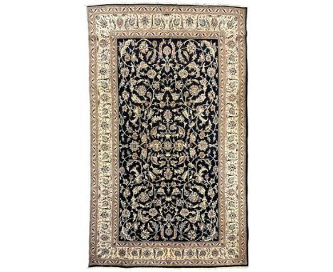 Central Persian part silk indigo ground Nain carpet, the field decorated with interlacing leafy branches and stylised plant m