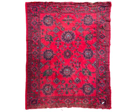 Early 20th century Western Anatolia Turkish Oushak crimson ground carpet, decorated with large Palmettes with trailing branch