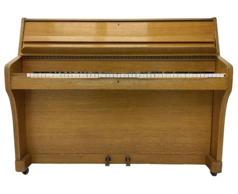 Kemble - English 20th century compact upright piano in light oak case, with an overstrung cast iron frame, underdamper action