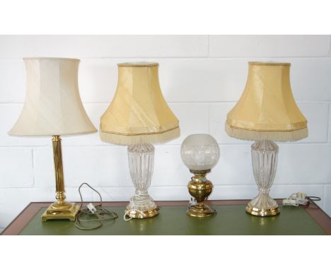 Pair of moulded fluted glass baluster table lamps each with floral decoration, on a circular base, H 49.5cm, with shade, bras