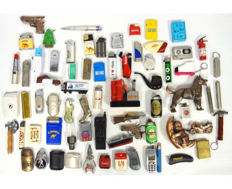 Collection of novelty cigarette lighters including a liner, Honda motorbike, mobile phone, Alsatian dog, detonator, hammer, b