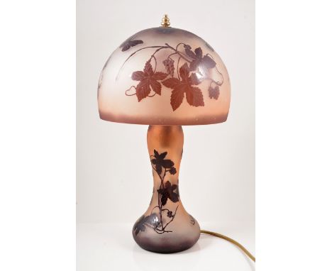 La Rochere, a cameo glass table lamp, the domed shade acid-etched with butterflies and foliage, supported by an organic form 