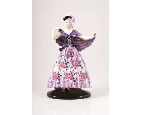 Stefan Dakon for Goldscheider, a pottery figure of a lady, circa 1930, in crinoline dress, printed in mauve and pink floral p