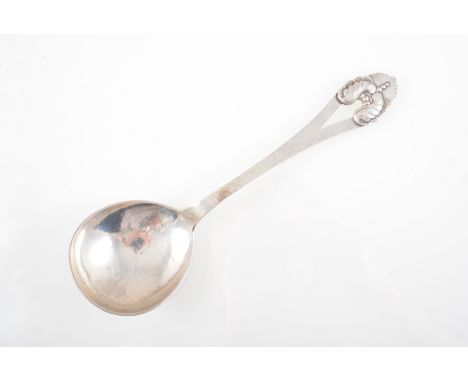 Christian Heise, a large Danish white metal serving spoon, 1923, martele finish, acanthus leaf open terminal, stamped makers 