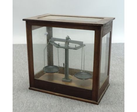 A set of mid 20th century precision scales, in a glass case, 45cm