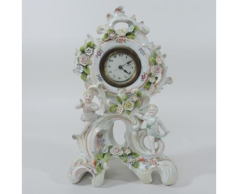 A Dresden style porcelain mantel clock, 27cm tall