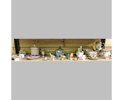 Two shelves of china, to include Royal Worcester models of birds, Staffordshire figures and continental china to include trin