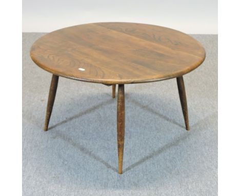 A 1960's Ercol dark elm coffee table, 75cm