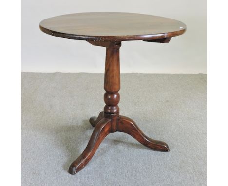 An oak tripod table, 76cm