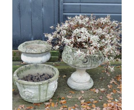 A reconstituted stone planter on stand, 50cm tall overall, together with two others smaller