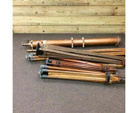 A telescope, 141cm, together with a collection of wood and metal bound tripod stands