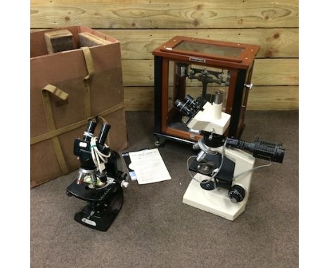 A set of aperiodic scales, in a glass case, with original travel case, together with two microscopes, a typewriter and a wood
