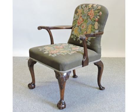 An early 20th century carved walnut and tapestry upholstered armchair, of George I style, on cabriole legs